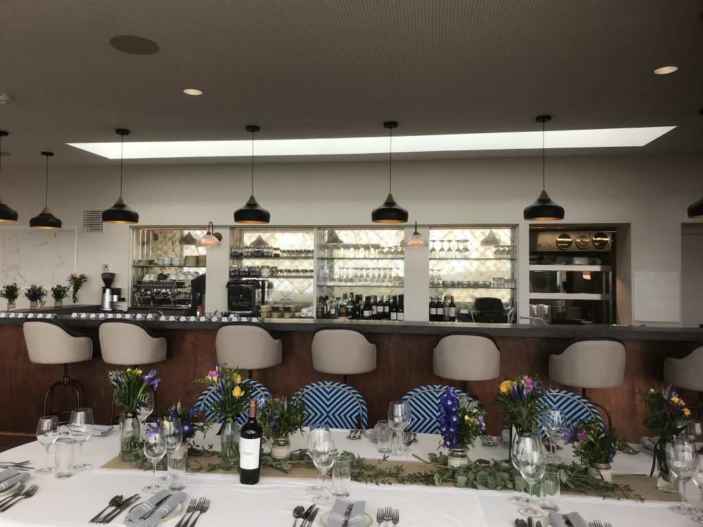 Modern sleek bar serving cocktails, non-alcoholic drinks, and more in a stylish interior